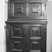 Interior. View of carved oak cabinet.