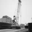 Aberdeen, York Place, Hall Russell Shipyard.
General view from North-East on quayside showing the 1974 Coles Centurion 48 ton diesel-electric mobile crane, with 90 ft jib and hydraulic-wheeled outriggers.
