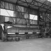 Aberdeen, York Place, Hall Russell Shipyard.
General interior view from North in bay 2 of platers' shop showing a plate-bending roller made by James Bennig and Sons of Glasgow. (Rolls 9.3m long).
