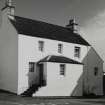 Inveraray, Church Square.
View of white-washed house with forestair to North-West of  Court House.