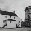 Inveraray, Church Square.
View of white-washed house with forestair in North East corner of Square.