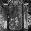 Inveraray, Kilmalieu Burial Ground,
View of mural monument to J. Colquhoun. A monument with a curving broken pediment, with the head of a deer below.