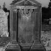 Inveraray, Kilmalieu Burial Ground.
View of headstone of Alexander McNuier, 1748. A classical pediment resting on columns, with a pair of crossed spades in the pediment and a winged soul below. Insc: 'Interr here Alex McNuier, Burgess in Inverr. Who died 8th June 1748. Erected by John McNuier his son Gardner in Inverr. Jean McNaladge, his Spouse 1769'.