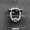 Inveraray, Main Street.
Detail of brass knocker on door of house on East side.