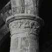 S choir-arcade, first column from W, showing foot soldier following rider.