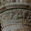 Detail of S choir-arcade, first column from W, showing foot soldier following rider.