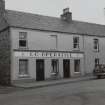 Main Street, Bowmore, Islay.
View of Co-operative on East side of street.