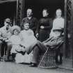 Ardimersay Cottage, Islay.
Family portrait of John and Lucy Ramsay and friends sitting on porch of cottage.