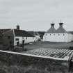 Ardbeg Distillery
General view from SE of two kilns at S end of E maltings, the two kilns having recently been converted into a Visitors Centre following the takeover by Glenmorangie