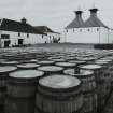 Ardbeg Distillery
View with barrels in forebround of two kilns at S end of E maltings