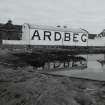 Ardbeg Distillery
View from S of S (seaward) side of distillery, showing bonded warehouse bearing the name 'ARDBEG' in large letters, designed to catch the eye of passing ferry passengers