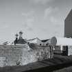 Bowmore Distillery
View from W showing the roofs of the two kilns, and the gables of the neighbouring floor maltings