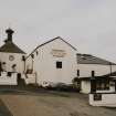 Bowmore Distillery
View from NE across E yard of distillery, showing NE side of maltings and kilns, the mash house and tun room, and (right) the visitors' centre.  Bowmore distillery is one of only two distilleries on Islay that continues to floor-malt its barley