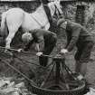 Farmstead, Conisby, Islay.
View of Fletcher brothers adjusting the horse-gang machinery.