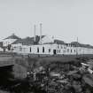 Islay, Bruichladdich Distillery
General view of distillery from SE after it became 'silent' in the mid-1990s.  In order to prevent irreversible decay, a small batch of whisky is made every year to keep the plant in working order