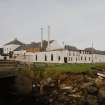 Islay, Bruichladdich Distillery
General view of distillery from SE after it became 'silent' in the mid-1990s.  In order to prevent irreversible decay, a small batch of whisky is made every year to keep the plant in working order