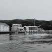 Islay, Caol Ila Distillery.
View from SE (from sea) of still house and other production buildings forming the N part of the distillery complex