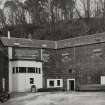 Mull, Tobermory, Eas Brae, Ledaig Distillery.
General view across yard to Mash House and Tun Room from East.
