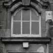 Arched window above  main entrance doorway, detail