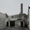 Lanark, North Vennel, Old Tannery: view from SE, showing square-section brick chimney stack.