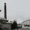 Lanark, North Vennel, Old Tannery: view from NE, showing round-section brick chimney stack.