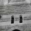 Detail of carved heads on South gable.