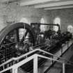 Interior. View from S within engine house showing steam engine.  Similar to the original engine, this is a 250hp twin-tandem compound mill engine by Petrie of Rochdale (1912) re-located from Philiphaugh Mill near Selkirk by the New Lanark Conservation Trust