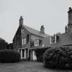 View of South wing and stable block from South East