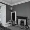 Interior, view of sitting room showing Jansen designed mahogany fireplace