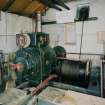 Interior. View within winding-engine house showing electric winder, cable and drum.