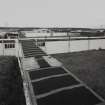 View from W of covered wooden gangways linking Wet Magazine DX2 (L) with Drying Stove DS3 (R), and Sieving & De-lumping DZ2 (far R)