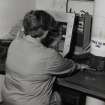 DL5, Electrofuse Assembly: detail of Ann Anderson at Position 3 in Compartment 6, operating a hand assembly machine