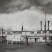 General exterior view of DD1 (Chemical Plant), with warning signs in foreground