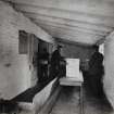 Photographic copy of Interior view in Blasting Department. Discharging cases of 'Samsonite' into storage magazines