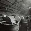 Photographic copy of glass negative of Interior.  Nitrocotton Department. Pulping and Finishing House showing Pulpers (2) (2596w)