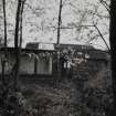 View of ruinous house by gate