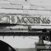 Detail of 'The Moorings' sign.