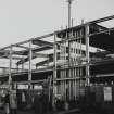 Copy of historic photograph showing view of building during early stages of construction.