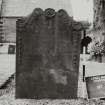 View of headstone with decorative central flower bordered by feathers and ribbons.
Insc: "In gratitude to the memory of Archibald Jamieson who died at Netherhall the 23rd? day of April 1798 aged 2 years.  This stone is ereced by John Alexander and Elizabeth? Jamieson's his children. "
Largs Parish Churchyard no 231
