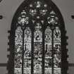 Interior. Detail of stained glass window above West gallery by Stephen Adam gifted by John Clark