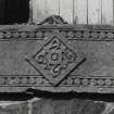 Detail of decorative carving on cill of doorway