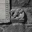 Detail of zoomorphic figure on right side of doorway
