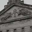Entrance front, pediment, centrally placed cross with two bas relief angels on either side, detail