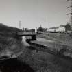 General view of Lambhill Bridge and Forth and Clyde Canal with towpath from E showing Skirsa Street housing