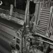 Glasgow, 171 Boden Street, Viyella Weaving Factory.
Detail of pirn magazine on end of saurer broadloom (in use).