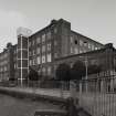 Glasgow, 121 Carstairs Street, Cotton Spinning Mills.
General view from SW of W and S sides of mill.