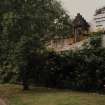 Glasgow, 161 Crookston Road.
General view of building obscured by garden.