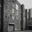 View of courtyard area from NW, showing part of former cotton mill