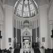 Interior. View of apse area of main hall from NW