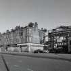 General view of tenements from ESE showing gateway to former meat market and  411 Gallowgate (former Bank of Scotland) to right